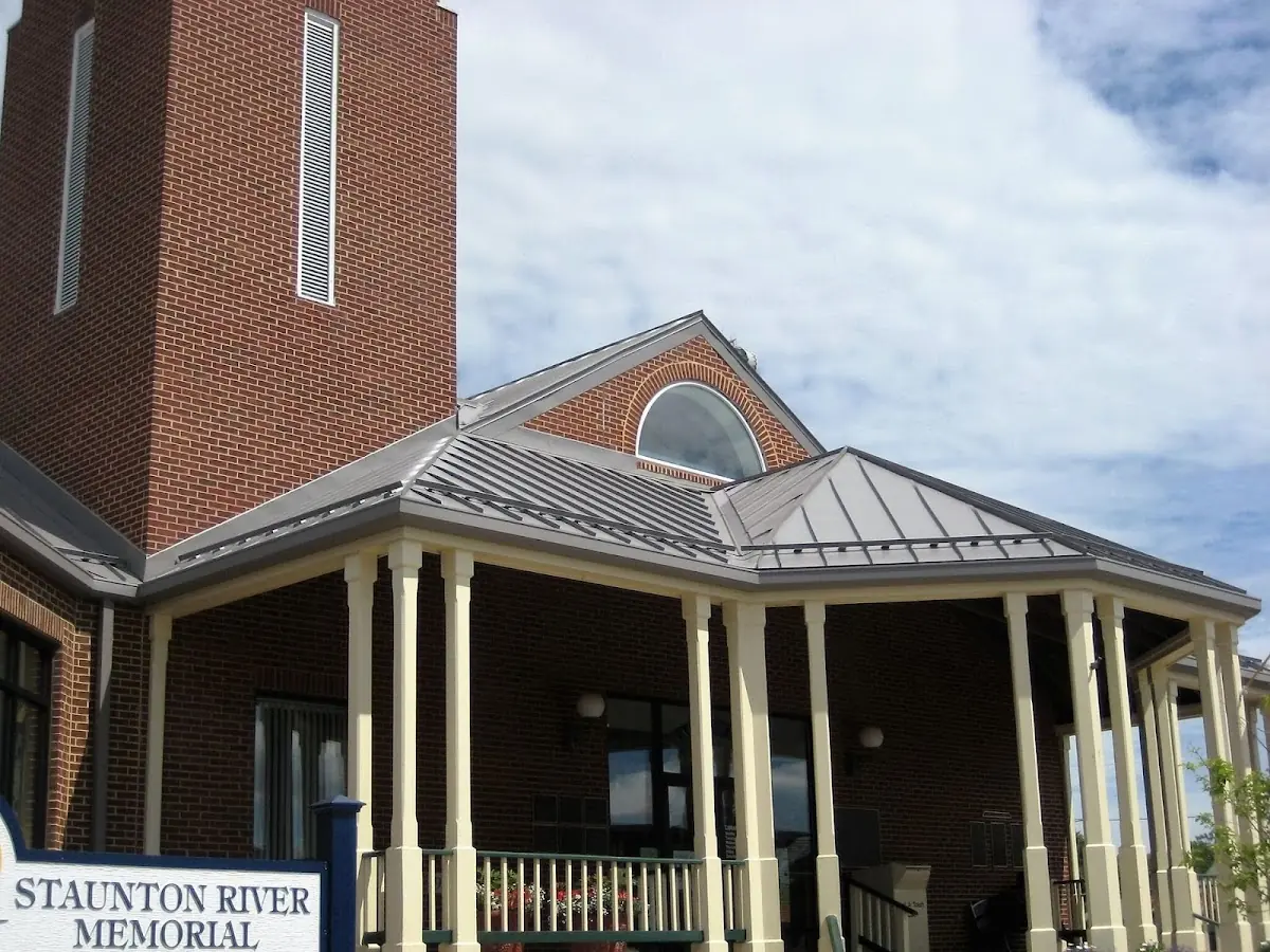 Skilled roofing craftsmen working on a residential roof in Bolivar